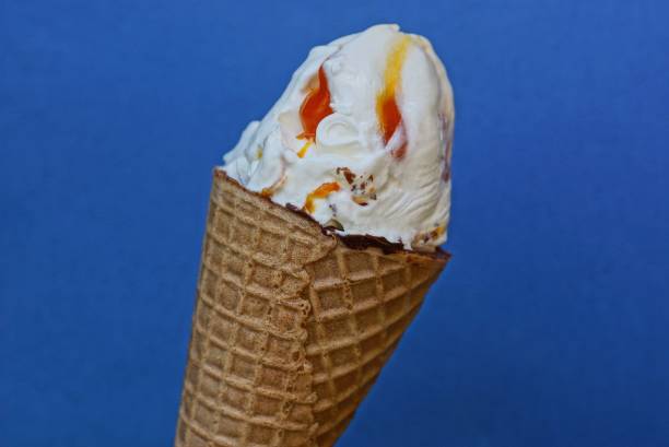 istock white ice cream with red jam in a brown waffle cup 1168595273