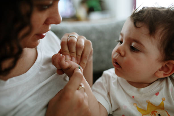 istock Cute Baby Boy With Mother At Home 1168596981