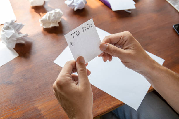 istock close-up of hands with a to-do list sheet without notes 1168598932