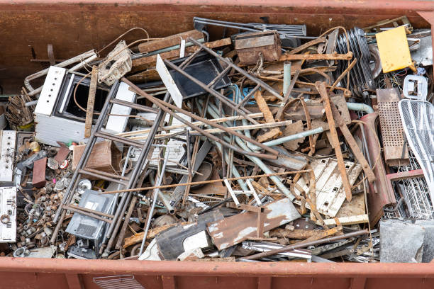 istock pile of old rusty scrap metal in a container 1168598943