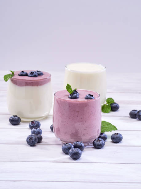 istock Fresh blueberry yogurt and mint leaves placed on a white wooden table. Fruit vitamins for health. 1168601053