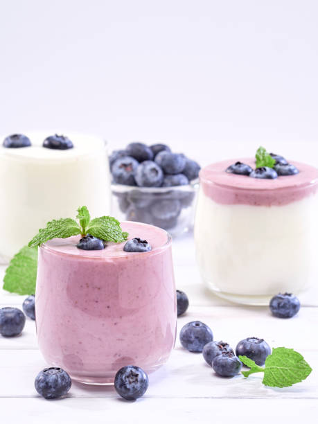 istock Fresh blueberry yogurt and mint leaves placed on a white wooden table. Fruit vitamins for health. 1168601086