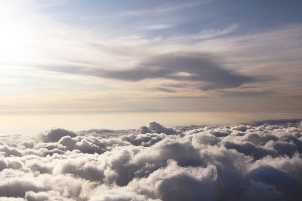 istock Sky view on the plane. Beautiful sky above clouds with dramatic light in the evening. Cabin view 1168601356