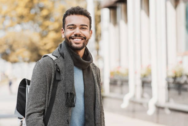 Handsome happy man autumn portrait Joyful smiling men in a city. Autumn and winter concept one young man only photos stock pictures, royalty-free photos & images