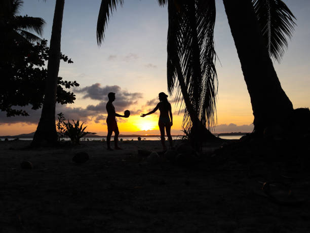 istock Couple watching sunset with palm trees in Palawan 1168605507