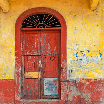 Vintage wooden door in the historic city center of Panama City, also known as Casco Antiguo and Casco Viajo or Old Quarter, Panama.