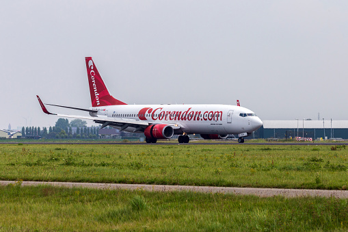 Amsterdam, The Netherlands - August 14, 2019: Corendon aircraft lands at Amsterdam Schiphol Airport (The Netherlands, AMS), Polderbaan.