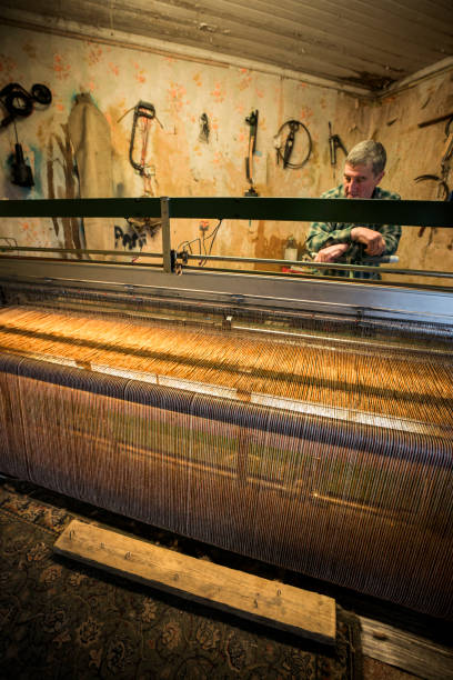 istock Man weaving tweed cloth 1168613205