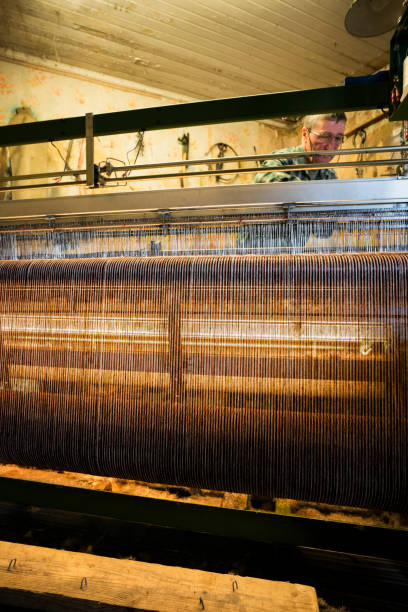 istock Man weaving tweed cloth 1168613223