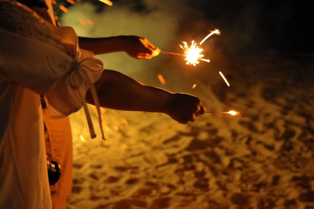 istock People who enjoy fireworks on hand 1168621109