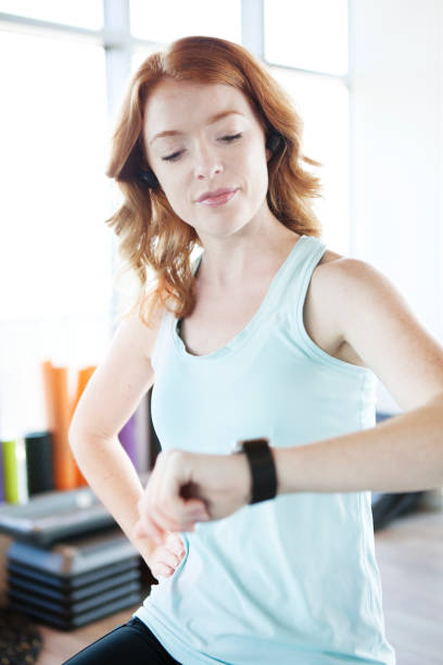istock Woman exercising at the gym 1168621511