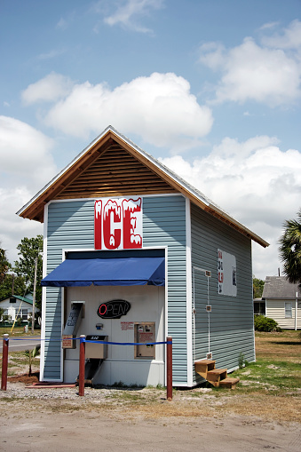 Ice machine house against powdery blue sky