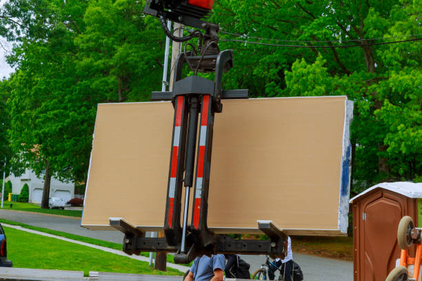 Forklifts in the construction of a built home under construction build with drywall