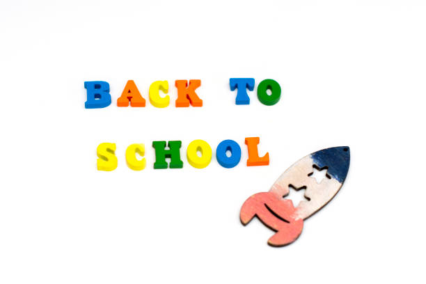 istock Text Back to school in colored wooden letters on white background. 1168623160