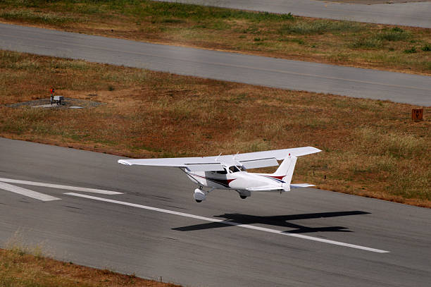 Private airplane landing. Viewed from behind and above. Cessna 172.