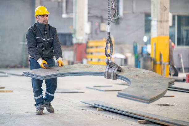 istock Senior worker holding and working with remote control for operating crane 1168630117
