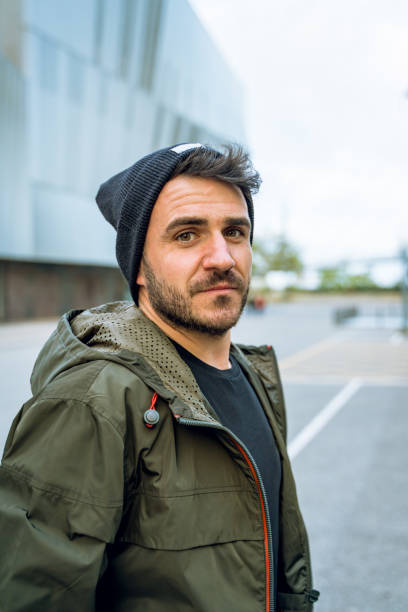 istock Friendly man with a wool hat at the street 1168631195