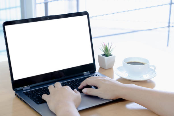 Using blank white screen laptop Using blank white screen laptop over the shoulder view photos stock pictures, royalty-free photos & images