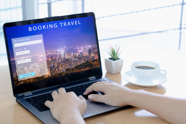istock Man using a laptop for booking hotel online. Tour reservation 1168631371