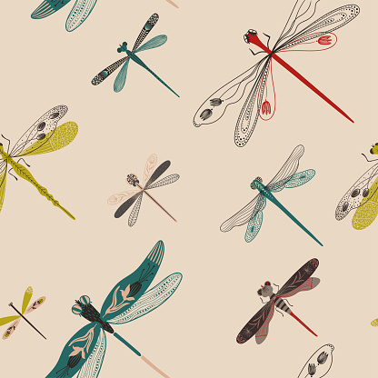 Folk art ornate insects background. Colorful seamless pattern of dragonflies with decorated wings.