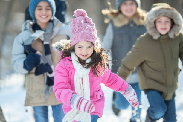 istock Diverse group of kids playing in the snow 1168639993