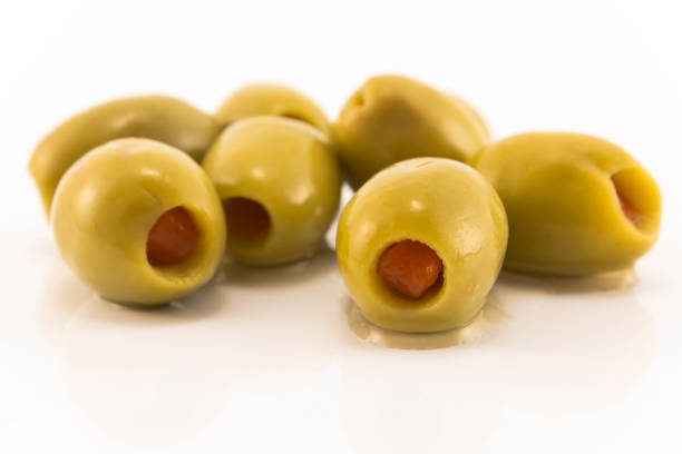 istock Green Olives Stuffed with Peppers, Isolated on White 1168642090