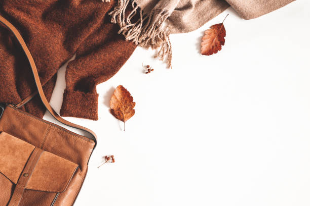 istock Autumn composition. Sweater, plaid, autumn leaves on white background. Flat lay, top view, copy space 1168643158