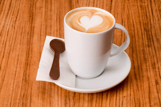 Heart Shaped Latte On The Wooden Table