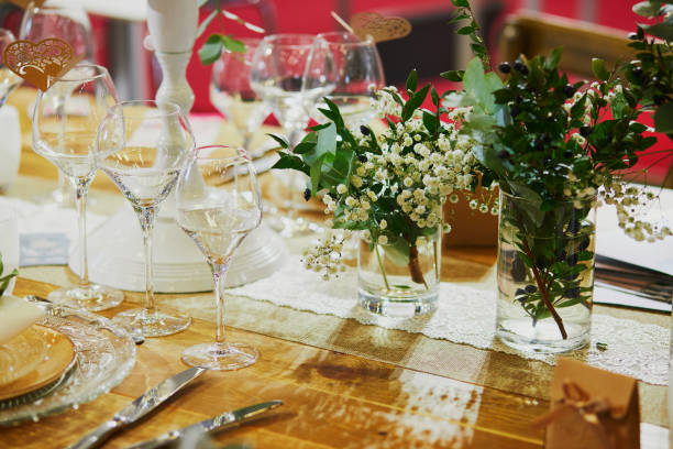 istock Beautiful table set with candles and flowers 1168645328