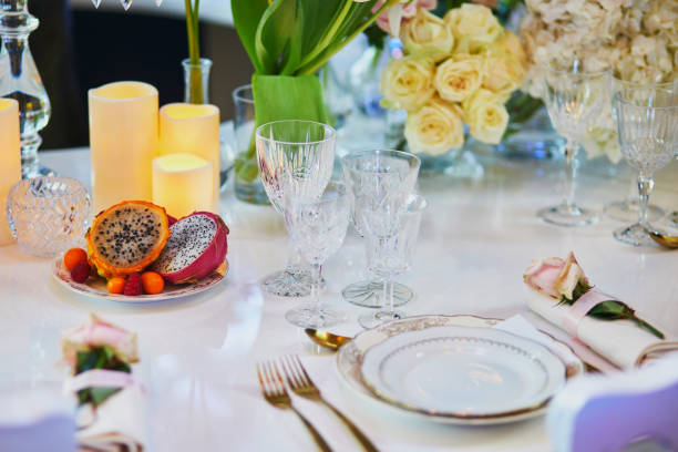 istock Beautiful table set with candles and flowers 1168645370