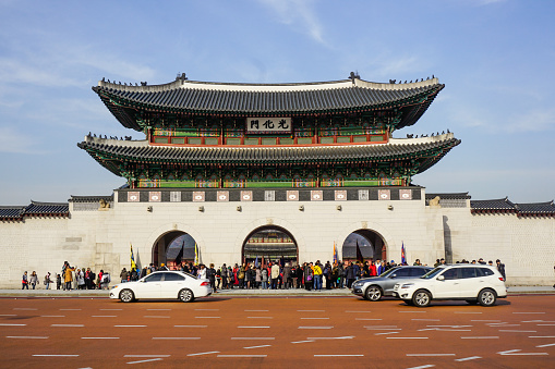 Seoul, South Korea - December 15, 2018: Royal Gyeongbokgung Palace in Seoul, where many people in traditional clothes and tourists are walking