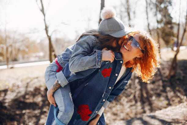 istock Elegant mother with daughter in a summer park 1168656979