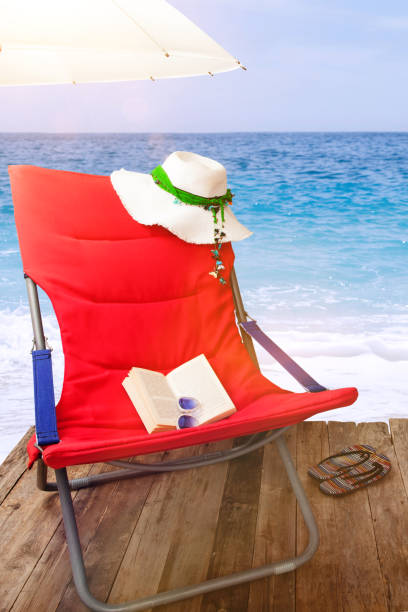 istock beach chair on the sunny beach 1168657355