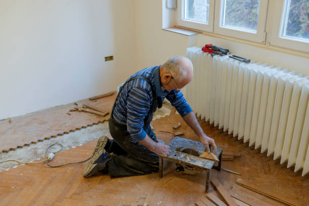 istock Senior Parquet Worker is Cutting the Floor Boards with Chop Saw 1168657449