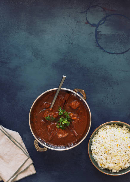 istock Rogan Josh lamb curry, authentic kashmiri lamb meat curry, served with pulao rice and garnished with coriander 1168659135
