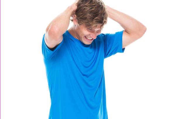 istock Handsome man in sports clothing has a headache 1168659357