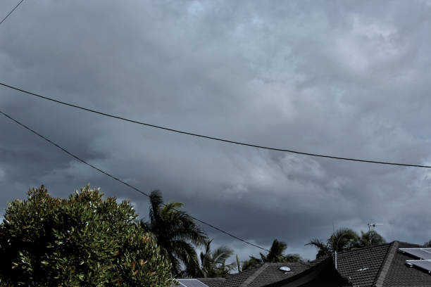 istock Storm Clouds over Roof tops 1168660179