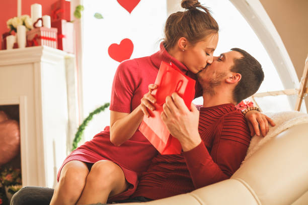 istock Young couple kissing on Valentine's day 1168661419