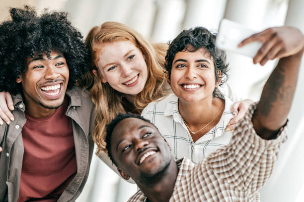 istock Group of students posing for photos 1168661473