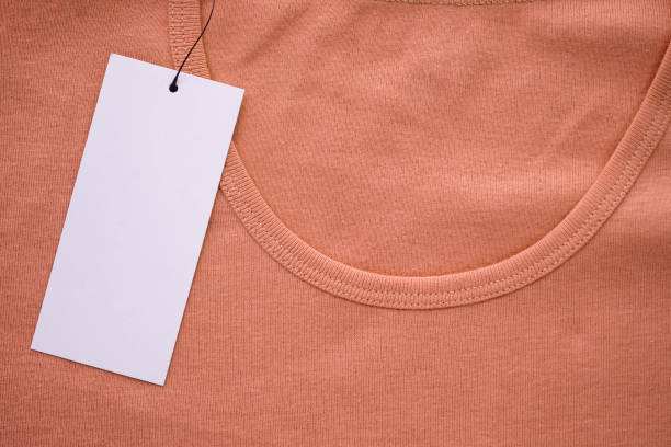istock Blank white clothes tag label on new shirt 1168662284