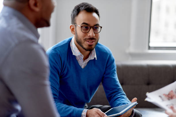 istock Indian businessman leading a team of creative millenials collaborating on a brainstorm project 1168662436