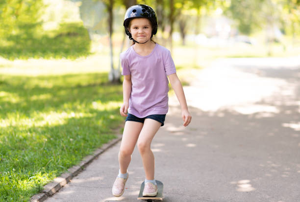 istock Little skates on one leg. In a helmet. 1168665615
