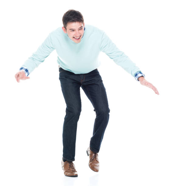istock Handsome young man walking carefully / tip toe 1168665619