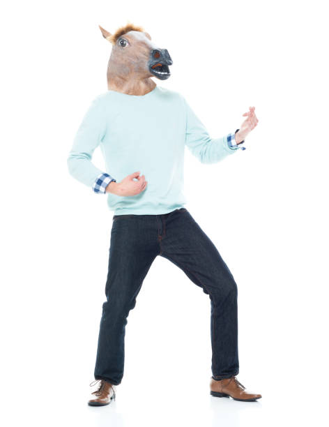 istock Man with horse mask doing air guitar 1168665689