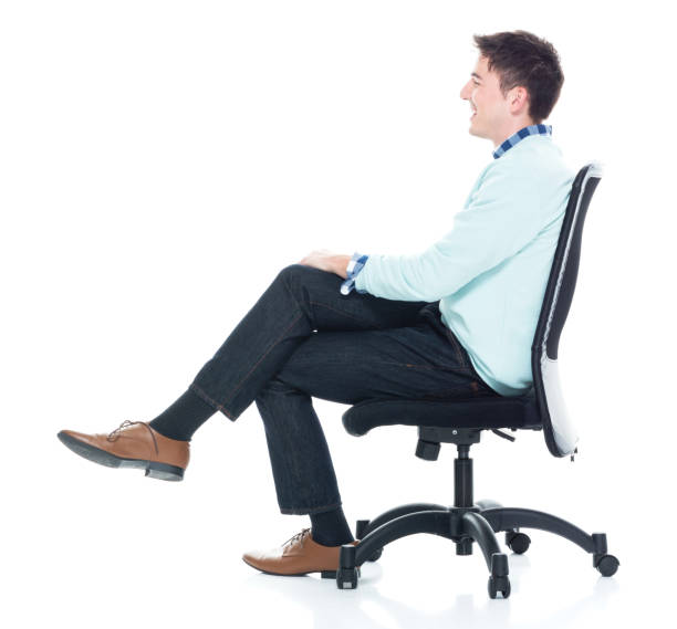 istock Handsome young man sitting and and being happy, side view 1168666248