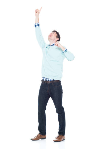 istock Handsome young man looking up and cheering 1168666290