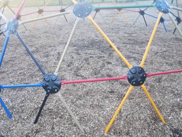 istock colorful metal jungle gym with triangles on playground 1168667354