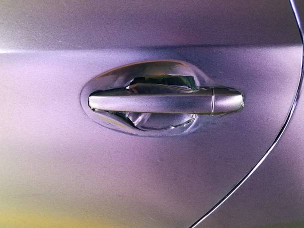 istock worn purple wrap on automobile with door handle 1168668231
