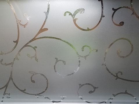 frosted glass window pane with lines and curves