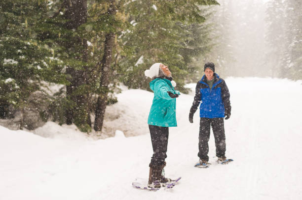 istock A senior couple snowshoeing in the forest 1168669066